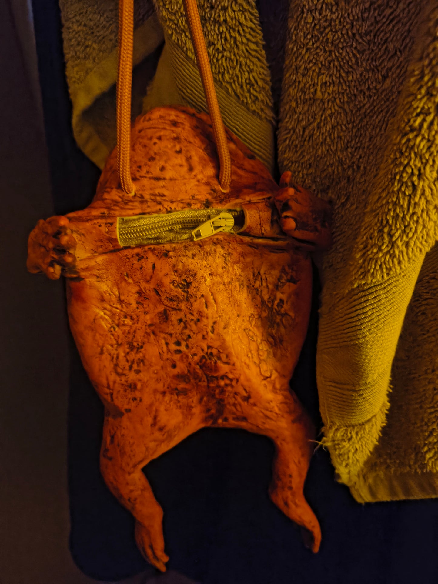 A dumb rubber toad purse