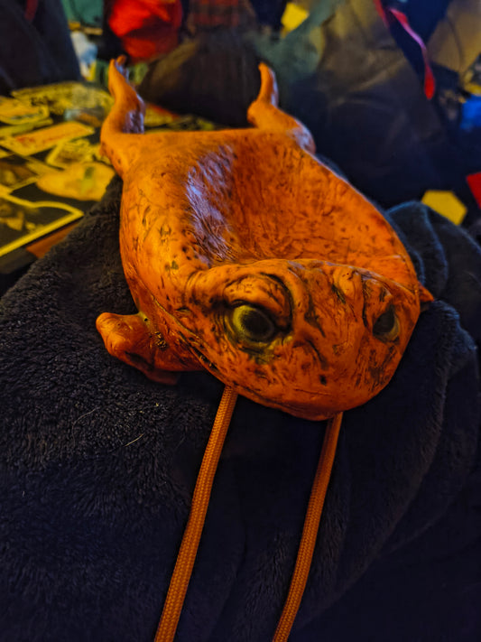 A dumb rubber toad purse